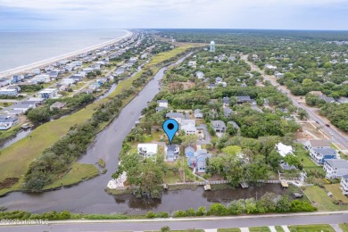 Discover your ideal canal front cottage right in time for on Founders Club At St. James Plantation in North Carolina - for sale on GolfHomes.com, golf home, golf lot