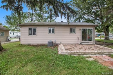 Nestled at the end of a quiet dead-end street, this beautifully on Lake Erie Metropark Golf Course in Michigan - for sale on GolfHomes.com, golf home, golf lot