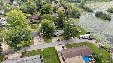 Nestled at the end of a quiet dead-end street, this beautifully on Lake Erie Metropark Golf Course in Michigan - for sale on GolfHomes.com, golf home, golf lot