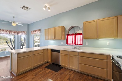 Wake up to sweeping views of the 18th tee from this impeccably on Coyote Lakes Golf Club in Arizona - for sale on GolfHomes.com, golf home, golf lot