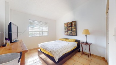 This beautifully updated condo in Bonita Golf View Villas is on Country Club of Miami in Florida - for sale on GolfHomes.com, golf home, golf lot