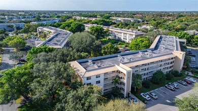 Welcome home to this desirable ground floor condo in one of the on Wynmoor Golf Course in Florida - for sale on GolfHomes.com, golf home, golf lot