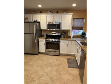 This home is in a desirable area and features an extra room off on Bacall Executive Golf Course in Florida - for sale on GolfHomes.com, golf home, golf lot