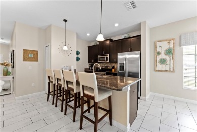 This townhome doesn't just check boxes -- it delivers the kind on The Oasis Club at Champions Gate in Florida - for sale on GolfHomes.com, golf home, golf lot