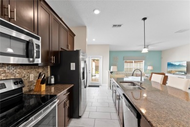 This townhome doesn't just check boxes -- it delivers the kind on The Oasis Club at Champions Gate in Florida - for sale on GolfHomes.com, golf home, golf lot