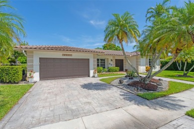 This charming 3-bed/2.5-bath home with a screened-in pool has a on Bonaventure Country Club in Florida - for sale on GolfHomes.com, golf home, golf lot