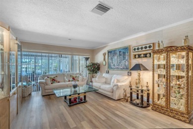 This charming 3-bed/2.5-bath home with a screened-in pool has a on Bonaventure Country Club in Florida - for sale on GolfHomes.com, golf home, golf lot