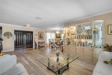 This charming 3-bed/2.5-bath home with a screened-in pool has a on Bonaventure Country Club in Florida - for sale on GolfHomes.com, golf home, golf lot