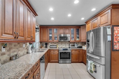 This charming 3-bed/2.5-bath home with a screened-in pool has a on Bonaventure Country Club in Florida - for sale on GolfHomes.com, golf home, golf lot