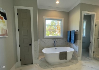 This custom-built 4-bedroom, 3.5-bath home boasts captivating on Chapel Ridge Golf Club in North Carolina - for sale on GolfHomes.com, golf home, golf lot