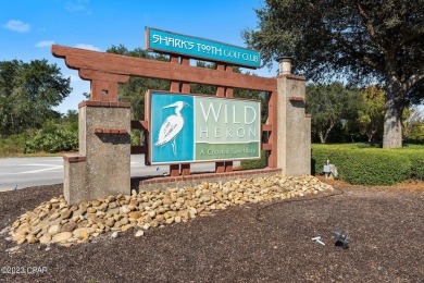 This prime golf course lot in Wild Heron is the perfect location on Sharks Tooth Golf Club in Florida - for sale on GolfHomes.com, golf home, golf lot