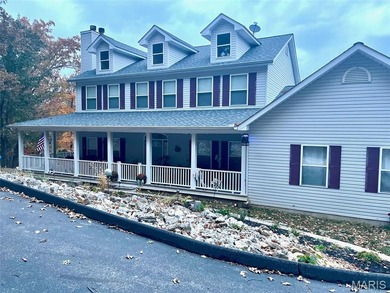 This stunning two-story home offers over 4,000 square feet of on Raintree Country Club in Missouri - for sale on GolfHomes.com, golf home, golf lot