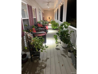 This stunning two-story home offers over 4,000 square feet of on Raintree Country Club in Missouri - for sale on GolfHomes.com, golf home, golf lot