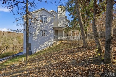 This stunning two-story home offers over 4,000 square feet of on Raintree Country Club in Missouri - for sale on GolfHomes.com, golf home, golf lot