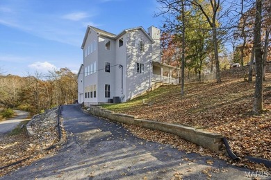 This stunning two-story home offers over 4,000 square feet of on Raintree Country Club in Missouri - for sale on GolfHomes.com, golf home, golf lot