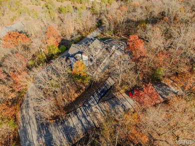 This stunning two-story home offers over 4,000 square feet of on Raintree Country Club in Missouri - for sale on GolfHomes.com, golf home, golf lot