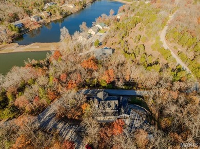 This stunning two-story home offers over 4,000 square feet of on Raintree Country Club in Missouri - for sale on GolfHomes.com, golf home, golf lot