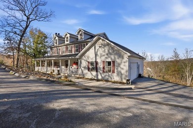 This stunning two-story home offers over 4,000 square feet of on Raintree Country Club in Missouri - for sale on GolfHomes.com, golf home, golf lot