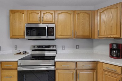 Located in the 55+ community of High Vista, this Ridge Crest on Ridgewood Lakes Golf and Country Club in Florida - for sale on GolfHomes.com, golf home, golf lot