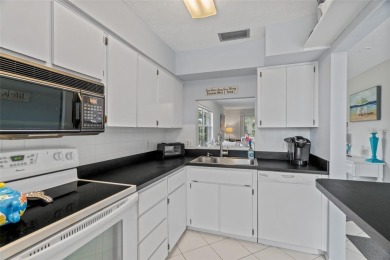 STUNNING VIEW! Perfect location to enjoy this 2 bed 2 bath on Seven Springs Golf and Country Club in Florida - for sale on GolfHomes.com, golf home, golf lot
