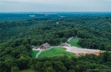 A 263-acre waterfront property with a three-slip dock, located on Bayview Golf Course in Missouri - for sale on GolfHomes.com, golf home, golf lot