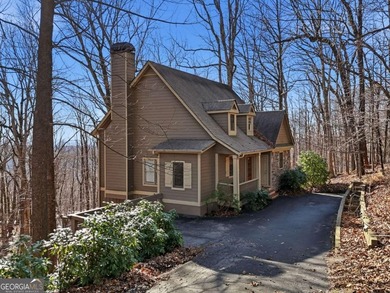 At 2,600-foot elevation, this stunning Craftsman-style retreat on Big Canoe Golf Club - Cherokee in Georgia - for sale on GolfHomes.com, golf home, golf lot