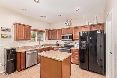 This spacious 3-bedroom, 2.5-bath home offers 2,440 sqft of on The Golf Club At Johnson Ranch in Arizona - for sale on GolfHomes.com, golf home, golf lot