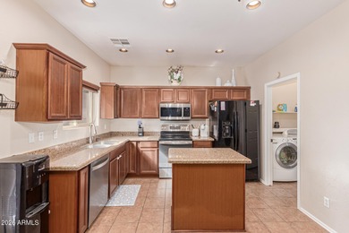 This spacious 3-bedroom, 2.5-bath home offers 2,440 sqft of on The Golf Club At Johnson Ranch in Arizona - for sale on GolfHomes.com, golf home, golf lot