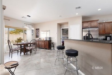 Stone facade adds aesthetic appeal to this 2-BR home plus den on Conestoga Golf Club in Nevada - for sale on GolfHomes.com, golf home, golf lot