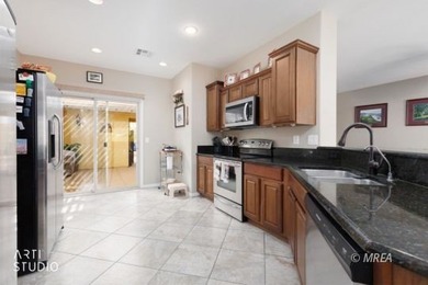 Stone facade adds aesthetic appeal to this 2-BR home plus den on Conestoga Golf Club in Nevada - for sale on GolfHomes.com, golf home, golf lot