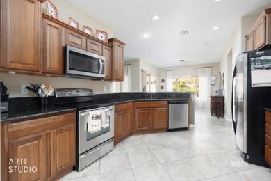 Stone facade adds aesthetic appeal to this 2-BR home plus den on Conestoga Golf Club in Nevada - for sale on GolfHomes.com, golf home, golf lot