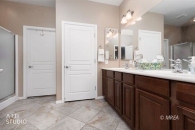 Stone facade adds aesthetic appeal to this 2-BR home plus den on Conestoga Golf Club in Nevada - for sale on GolfHomes.com, golf home, golf lot