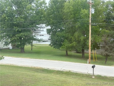 THE VIEWS!! THE SHORES!! SUNNY SLOPE CIRCLE IS THE PLACE TO 
 on Lake Valley Country Club in Missouri - for sale on GolfHomes.com, golf home, golf lot