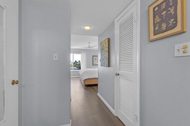 Step into paradise with this beautifully updated 2-bedroom on Ocean Village Golf Course in Florida - for sale on GolfHomes.com, golf home, golf lot