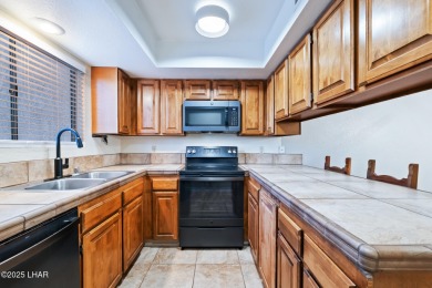 Enjoy panoramic views of the lake, golf course, and surrounding on London Bridge Golf Course in Arizona - for sale on GolfHomes.com, golf home, golf lot