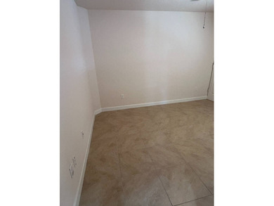 Foyer entry into the open living area with cathedral ceilings. A on Spanish Lakes Fairways in Florida - for sale on GolfHomes.com, golf home, golf lot