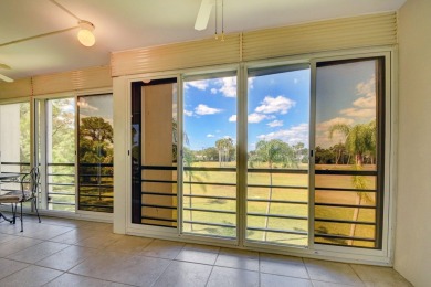 Discover your perfect retreat in this bright corner unit nestled on Poinciana Golf Club in Florida - for sale on GolfHomes.com, golf home, golf lot