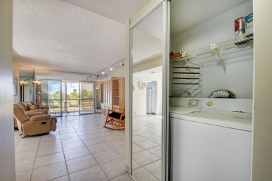 Discover your perfect retreat in this bright corner unit nestled on Poinciana Golf Club in Florida - for sale on GolfHomes.com, golf home, golf lot