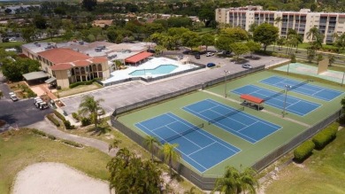 Discover your perfect retreat in this bright corner unit nestled on Poinciana Golf Club in Florida - for sale on GolfHomes.com, golf home, golf lot