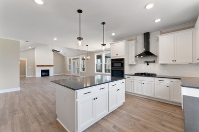 Live the lake life in this NEW Craftsman home in The Plantation on The Patriot Golf Club At Grand Harbor in South Carolina - for sale on GolfHomes.com, golf home, golf lot