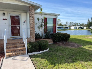 This lovely manufactured 2 bedroom, two bathroom home is on on Lake Fairways Country Club in Florida - for sale on GolfHomes.com, golf home, golf lot