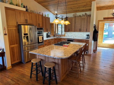 Beautiful open concept single level custom home overlooking the on Double Arrow Lodge in Montana - for sale on GolfHomes.com, golf home, golf lot