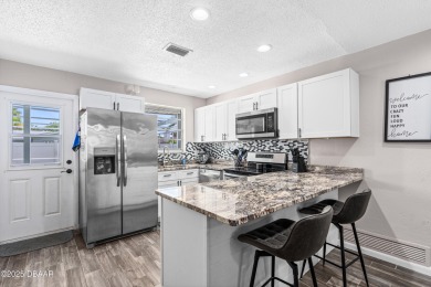 Beautifully updated 3 bedroom, 2 bath pool home in desirable on Daytona Beach Golf Club in Florida - for sale on GolfHomes.com, golf home, golf lot
