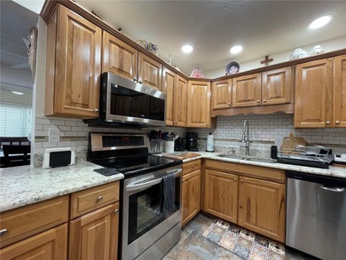 EXQUISITE Lakefront 55+ Residence | 2 Bed | 2 Bath | Private on Country Club At Silver Springs Shores in Florida - for sale on GolfHomes.com, golf home, golf lot