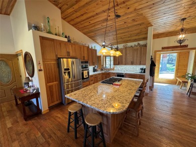 Beautiful open concept single level custom home overlooking the on Double Arrow Lodge in Montana - for sale on GolfHomes.com, golf home, golf lot