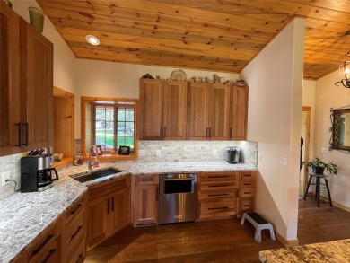 Beautiful open concept single level custom home overlooking the on Double Arrow Lodge in Montana - for sale on GolfHomes.com, golf home, golf lot