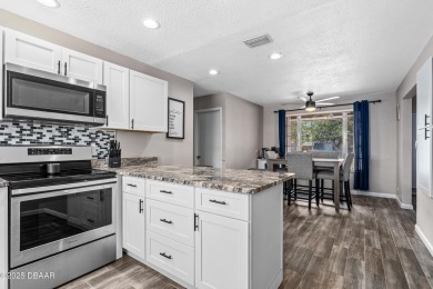 Beautifully updated 3 bedroom, 2 bath pool home in desirable on Daytona Beach Golf Club in Florida - for sale on GolfHomes.com, golf home, golf lot