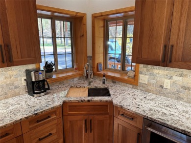 Beautiful open concept single level custom home overlooking the on Double Arrow Lodge in Montana - for sale on GolfHomes.com, golf home, golf lot