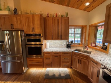 Beautiful open concept single level custom home overlooking the on Double Arrow Lodge in Montana - for sale on GolfHomes.com, golf home, golf lot