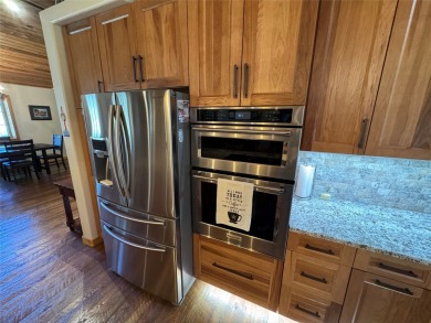 Beautiful open concept single level custom home overlooking the on Double Arrow Lodge in Montana - for sale on GolfHomes.com, golf home, golf lot